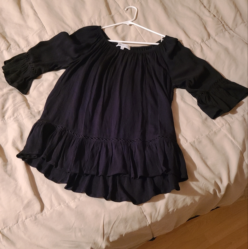 Great free flowing top with great detail. NWOT. Perfect condition.